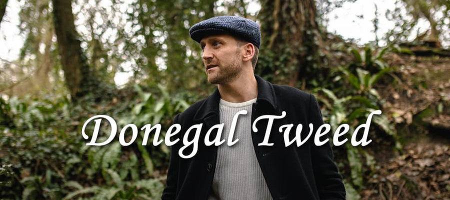 A man wearing a Donegal Tweed flat cap in the forest 